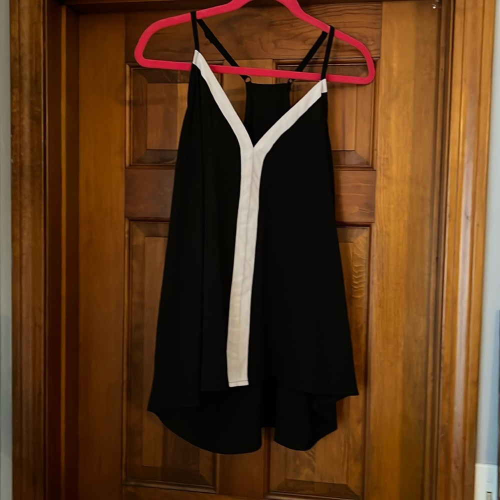 Black and white crêpe like material tank